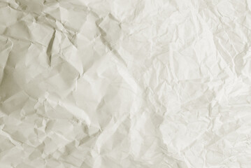 Crumpled white paper background.