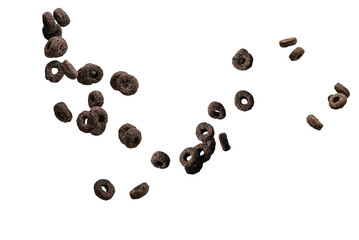 Chocolate rings cereal spill out into a bowl. Breakfast.