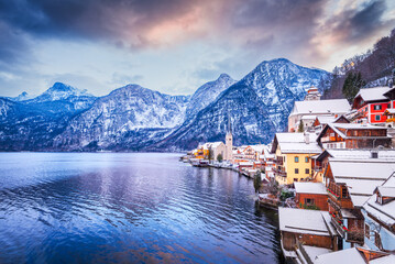 Hallstatt, Upper Austria. Serene twilight over snow covered alpine village and tranquil Hallstatterseet.