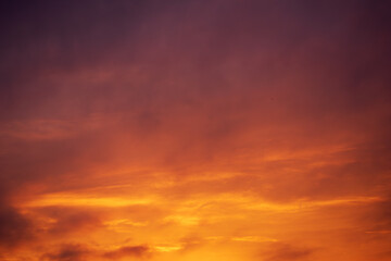 Abstract Texture of Intense Sunset Sky with Orange, Red, and Purple Hues