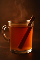 Warm apple cider drink with rich amber gradient, close-up view, soft light, subtle cinnamon aroma effect, perfect for autumn and winter beverage concepts.