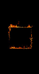 Photography of a burning wooden beam in frame shape isolated on a black background. Detailed fire...