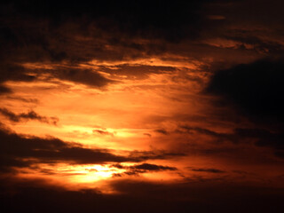 sun zoomed behind the clouds at the sunset over the Adriatic sea in Rovinj