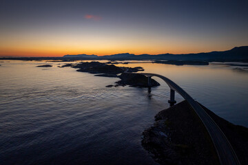 drone view of the Storseisundet Bridge on the Atlantic Ocean Road at sunrise © makasana photo