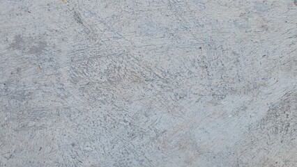 Fototapeta premium An image of a simple, light gray concrete surface with the natural rough texture of cement. Light Grey Concrete Texture. Rough Cement Wall or Floor Surface.