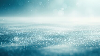 Shimmering blue bokeh particles and abstract light effects creating a magical, ethereal background.