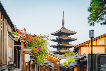 Traditional Japanese street scene with a pagoda in the background. Kyoto