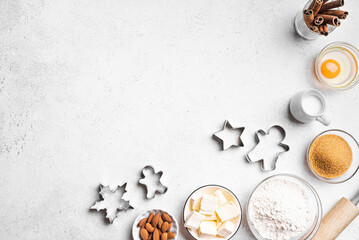 Christmas baking background with baking ingredients and cookie cutters