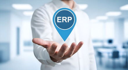 Businessman presenting a floating blue location pin icon labeled ERP above his open palm in a bright modern office environment symbolizing digital transformation and system integration