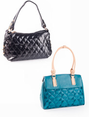 A small handbag with a textured front flap, a short shoulder strap, and a butterfly-shaped metal detail on the front.