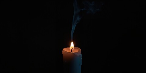 Black background with a burnt-out candle and smoke, highlighting fire hazard prevention