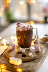 Marshmallow Hot Cocoa In The Making Against Festive Lights