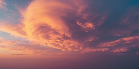 Obraz premium Clouds at sunset create a vibrant sky scene, suitable as a background for text and layout, Earth Day