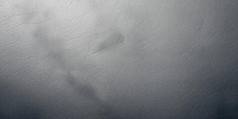 Microfiber leather material in cool grey tones serving as a background for editorial or UI layout purposes