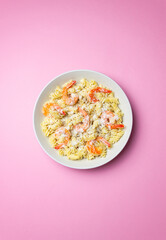 Pasta in a creamy sauce with shrimp and cheese. Italian cuisine.