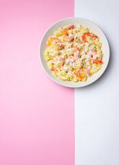 Pasta in a creamy sauce with shrimp and cheese. Italian cuisine.