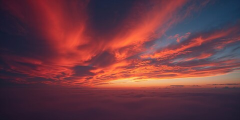 Fototapeta premium Sunset sky with red orange fire clouds, ideal for backgrounds and textures
