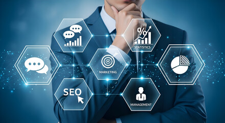 Businessman contemplates digital marketing strategy icons representing seo statistics communication and management on a futuristic blue interface