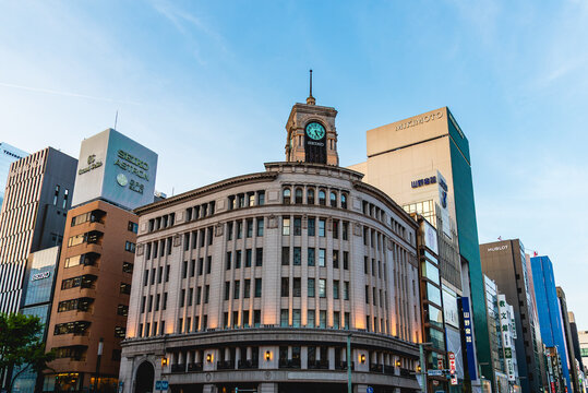 Wako Clock Tower in Ginza, Tokyo. This iconic landmark symbolizes luxury shopping and the vibrant atmosphere of Japan's commercial district. Perfect for travel and business themes.
