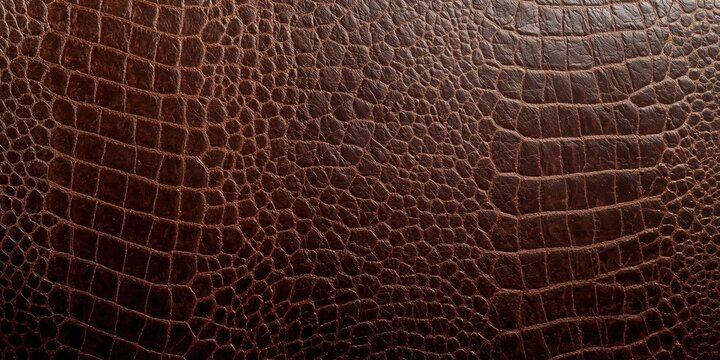 Brown croco embossed leather texture used as a background for text and layout, surface durability and pattern detail