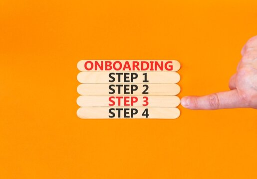 Time to step 3 onboarding symbol. Concept words Onboarding step 3 on beautiful wooden block. Businessman's hand. Beautiful orange background. Business success step 3 onboarding concept. Copy space.