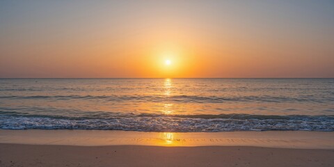 Fototapeta premium Golden sunset colors reflecting on the sea water surface, suitable as a background for travel websites, summer scenes, and nature themes