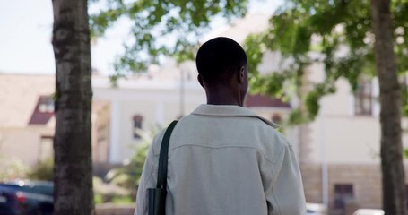 Back, student and black man in city, walking and travel with urban town, scholarship and university. Outdoor, commute and African person with higher education, college and pedestrian with gen z