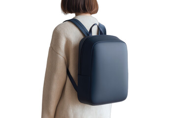 Minimalist dark blue backpack on a person wearing a cream sweater
