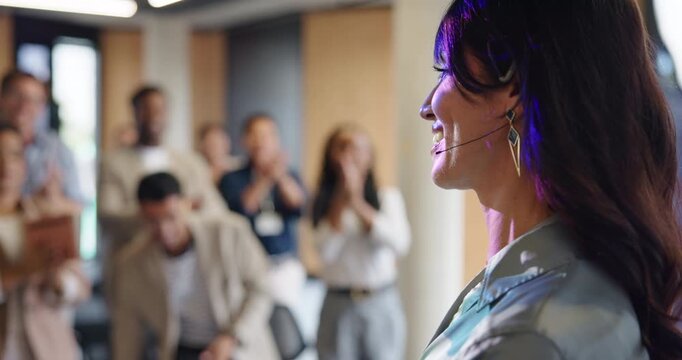 Business woman, conference and presentation for speaker in seminar room for training. Education, forum speech and microphone with corporate coach on stage for public relations and applause with crowd