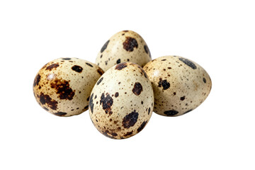 Close-up view of several quail eggs with spotted patterns