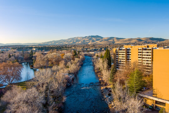 Aerial view of Reno Nevada looking Northwest from downtown with the Truckee River a residential area and Peavine mountain in the distance during late autumn