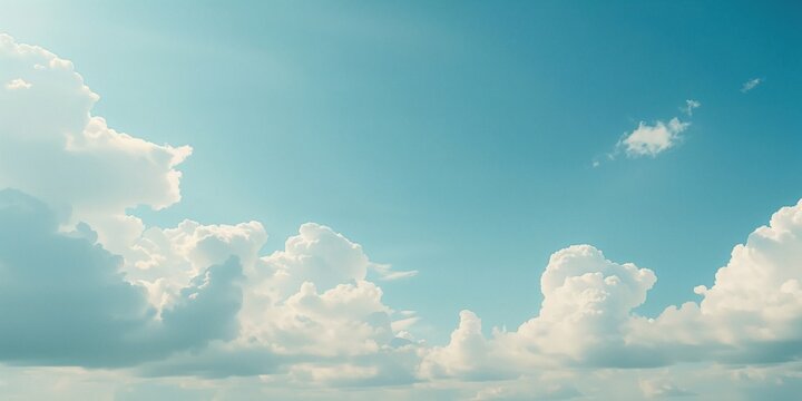 Blue sky with pale blue clouds, suitable as a backdrop for editorial headers or seasonal themes