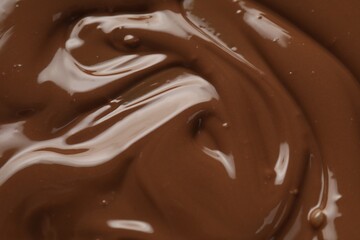 Tasty melted chocolate as background, top view