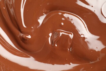 Tasty melted chocolate as background, top view