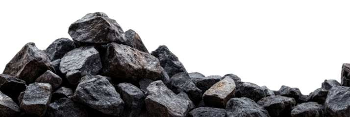 A pile of rough, dark grey, textured rocks against a black background