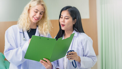 Professional Medical Doctors and team discussing in clinic hall, healthcare professionals having discussion in hospital corridor.