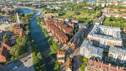 Aerial view of old town of Gdansk with colorful buildings, riverside architecture and urban scenery.
