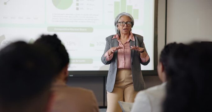 Conference, graphs and presentation with business woman at event for broker workshop, public speaking and seminar. Lecture, convention and tradeshow expo with employees at summit for investor data