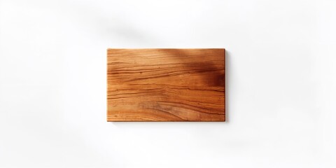 Naklejka premium Isolated clean wooden cutting board with textured surface, serving as a kitchen background for culinary activities
