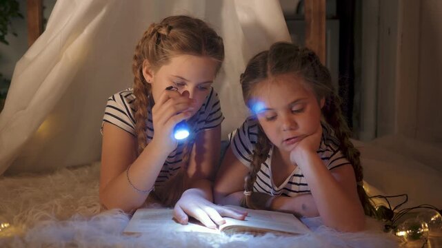 Girl and sister read book with flashlight inside fabric tent, sister braid hair, reading by warm light, cozy bedtime on rug with string light, focused face, quiet bond and playful imagination and