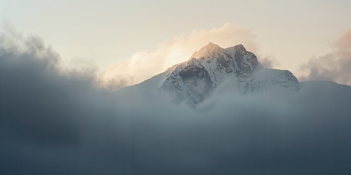 Ushba Mountain shrouded in morning clouds, illustrating natural weather patterns for climate awareness, Earth Day
