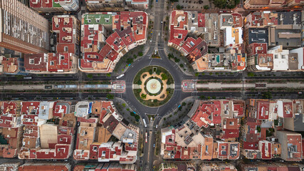 Aerial view of Alicante s circular plaza and colorful buildings, city s urban layout from above.