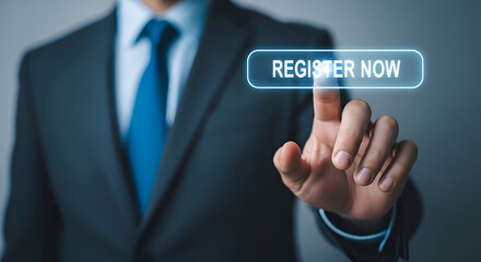 Businessman in dark suit and blue tie presses glowing digital register now button on futuristic interface for online subscription or service access