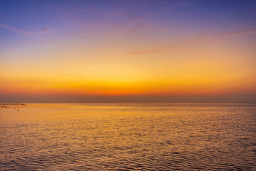 A view of the sea and a wooden bridge before sunrise in the morning,sunrise at the bridge view point of the sea