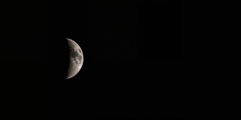 Moon with craters in deep black space, used as a background for text layouts