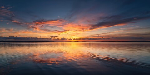 Lake at sunset with reflective water and colorful sky, serving as a serene background for text or design projects, World Environment Day
