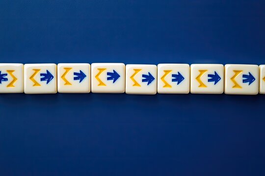 Line of white tiles, blue and yellow arrows