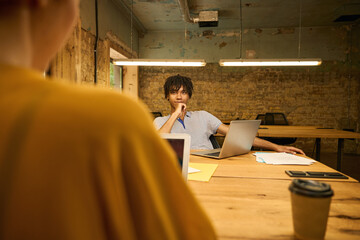 Man a focused on his laptop screen