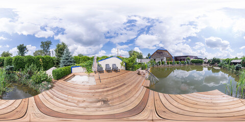 Seamless spherical HDRI panorama with a 360-degree angle view of a pier overlooking a lake. Panorama of a lake with a pier. VR content.