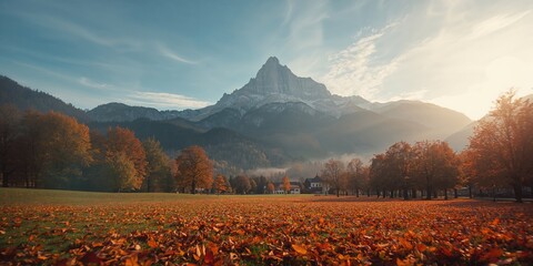 Scenic park scene with vibrant fall leaves in an alpine village setting, seasonal transition